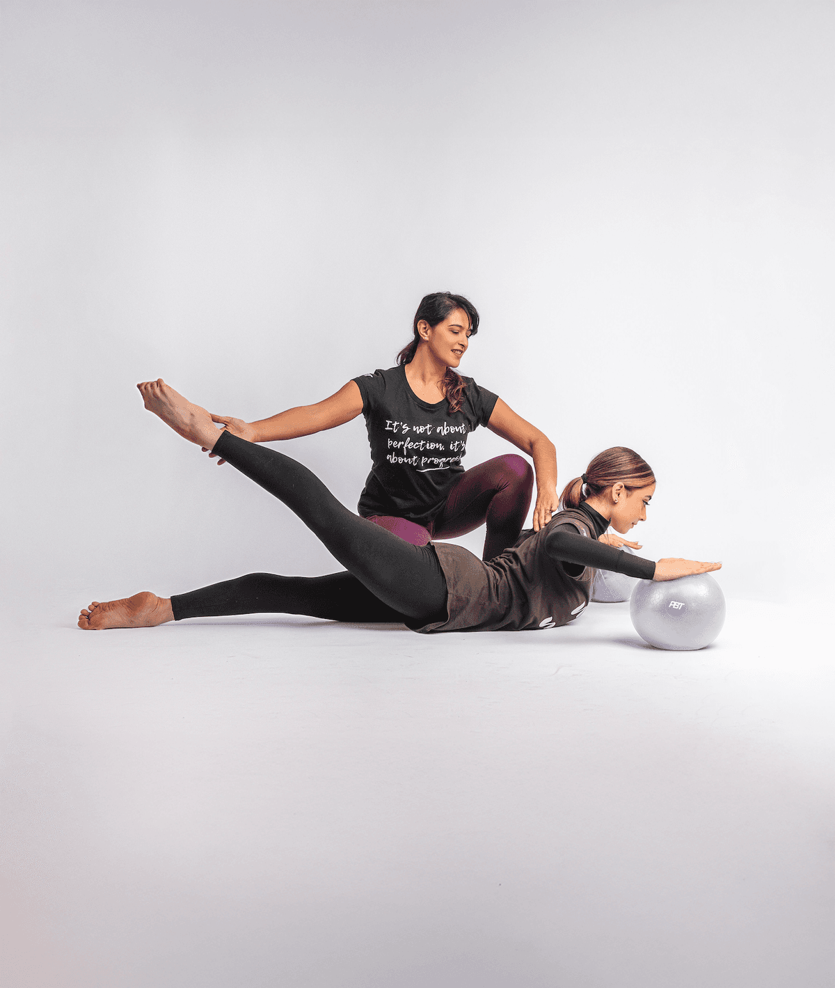 PBT tutor guiding a teacher through a conditioning exercise at a live workshop